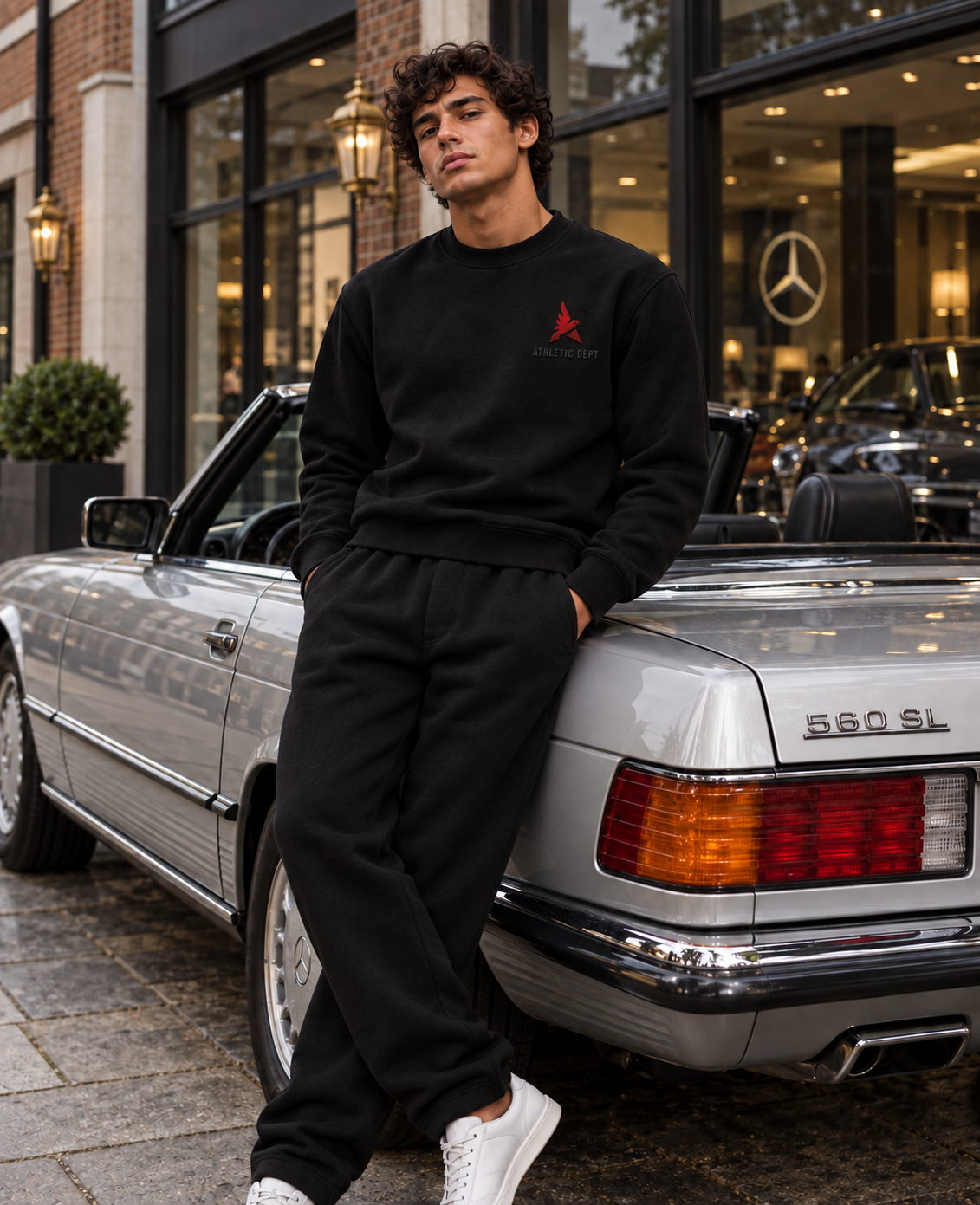 Black Drafted Brand sweatshirt with tonal black and red graphics, loose black sweats, front view