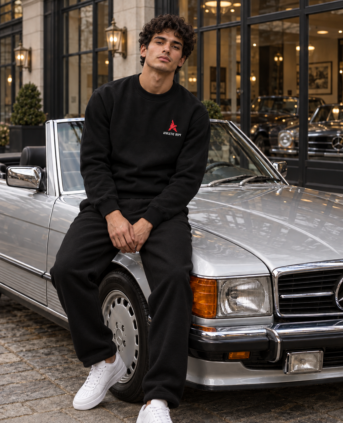 Black Drafted Brand sweatshirt with white and red print and loose black sweatpants, front view