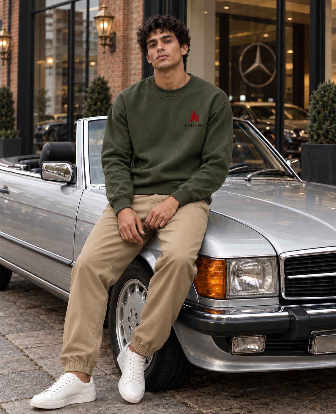 Army green Drafted Brand sweatshirt with tan khaki joggers, front view at London Mercedes dealership