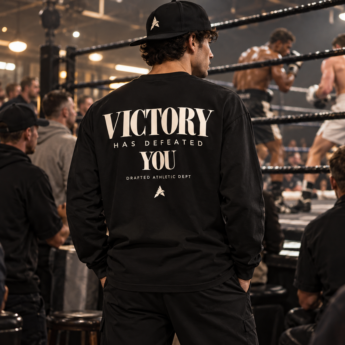 Black Victory shirt at a crowded boxing gym back view